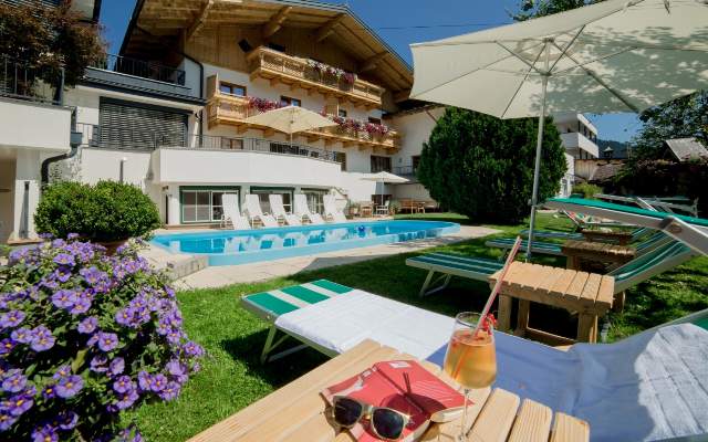 The solar-heated swimming pool is available to guests in summer
