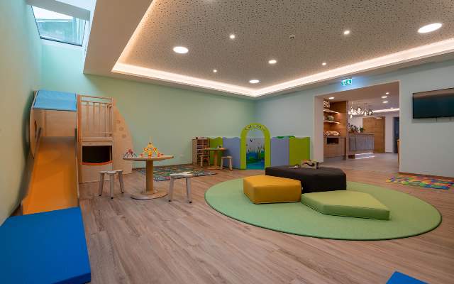 Children's playroom with slide in the entrance area of ​​the apartment house